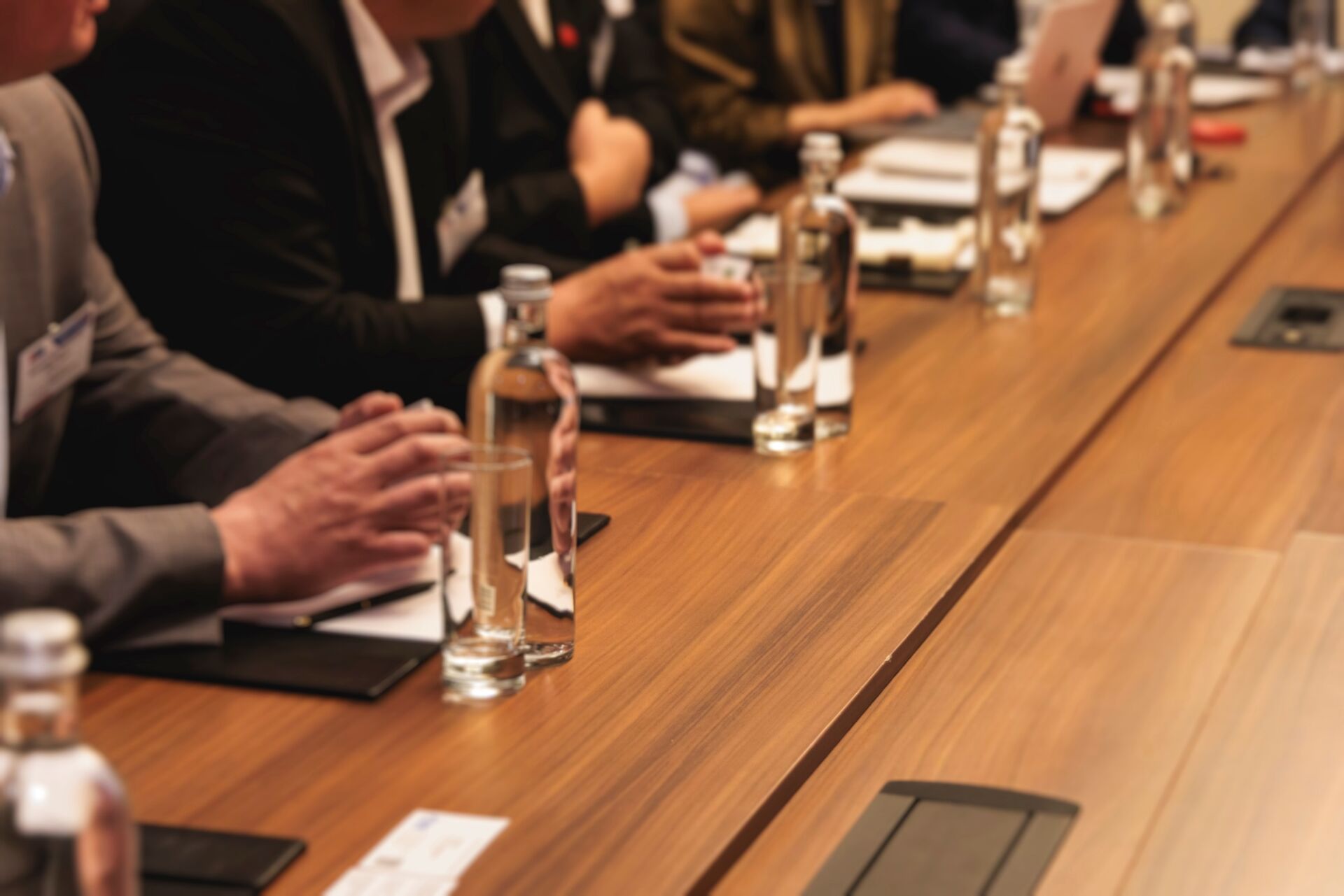 Diplomatic delegation meeting negotiation, group of men in business suits talking and discussing at conference, politicians debate and negotiate, businessmen have dialog, conversation on forum summit Enterprise Fellowship Scheme